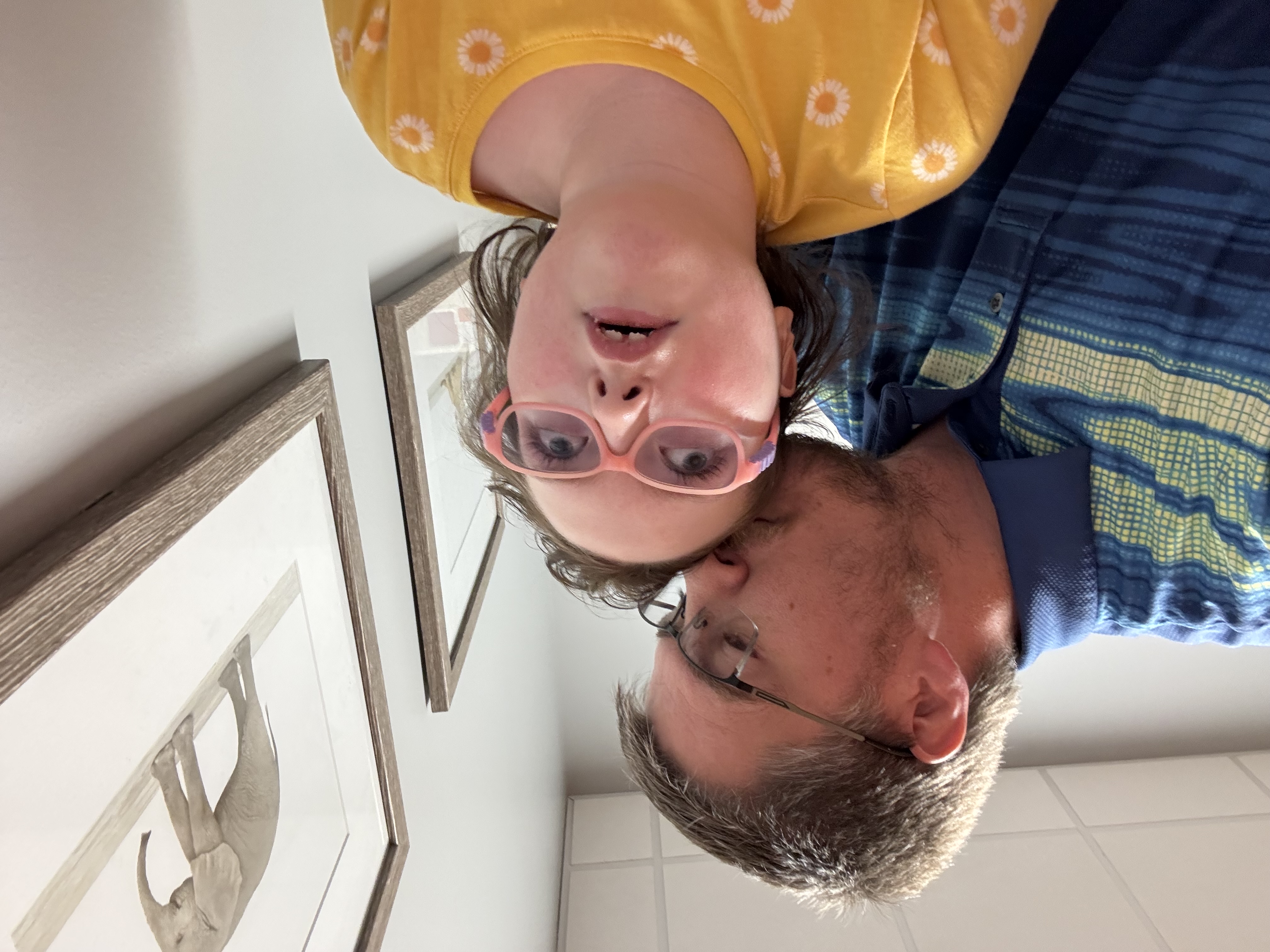 Cody kissing his daughter Sophia on the head