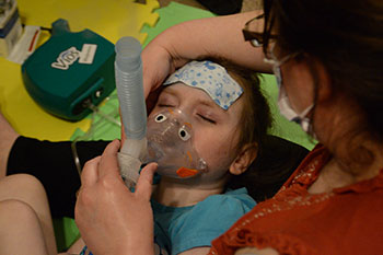 Sophia receiving breathing treatment